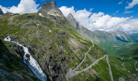 The Troll Road with its hairpin bends and the Stigfossen waterfall outside Åndalsnes, Norway
